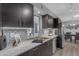 Stylish kitchen showcasing stainless steel appliances and modern fixtures with tile backsplash at 8064 E Madero Ave, Mesa, AZ 85209