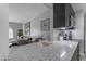 Modern kitchen with open view to living room and stylish countertops at 8064 E Madero Ave, Mesa, AZ 85209
