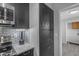 Kitchen corner featuring modern appliances, stylish backsplash, and plentiful storage at 8064 E Madero Ave, Mesa, AZ 85209