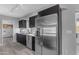 Well-equipped kitchen features stainless steel appliances, modern lighting, and ample cabinet space at 8064 E Madero Ave, Mesa, AZ 85209
