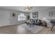 Inviting living room with plush seating, neutral tones, modern art, and an arched window at 8064 E Madero Ave, Mesa, AZ 85209