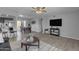 Open concept living area with a view of the dining room and kitchen, complete with modern furnishings at 8064 E Madero Ave, Mesa, AZ 85209