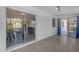 Sunroom with tile flooring and sliding glass doors provides an airy living space at 8064 E Madero Ave, Mesa, AZ 85209