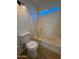 Bathroom featuring a toilet and shower-tub combo at 8154 W Greer Ave, Peoria, AZ 85345