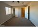 Bedroom with carpet, ceiling fan, window with blinds and closet at 8154 W Greer Ave, Peoria, AZ 85345