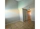 The bright bedroom features a large closet and tile flooring at 8154 W Greer Ave, Peoria, AZ 85345