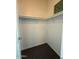 Empty walk-in closet with carpet flooring and plenty of shelf storage at 8154 W Greer Ave, Peoria, AZ 85345