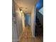 Hallway with tile floors, storage, access to the stairs and a neutral color palette at 8154 W Greer Ave, Peoria, AZ 85345