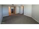 Living room view with a combination of tile and carpet flooring at 8154 W Greer Ave, Peoria, AZ 85345