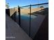 Backyard pool area with a safety fence and concrete decking at 8154 W Greer Ave, Peoria, AZ 85345