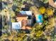 Expansive aerial view of a home with a terra cotta roof, pool, desert landscaping and circular driveway at 8155 E Juan Tabo Rd, Scottsdale, AZ 85255