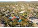 This aerial image captures a property with a pool, lush greenery, and homes dotting the landscape in a beautiful community at 8155 E Juan Tabo Rd, Scottsdale, AZ 85255