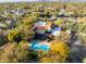 The property boasts a refreshing pool, complemented by lush trees, providing a relaxing outdoor living space at 8155 E Juan Tabo Rd, Scottsdale, AZ 85255