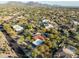 Aerial view of a neighborhood with mountain views and homes surrounded by desert landscaping at 8155 E Juan Tabo Rd, Scottsdale, AZ 85255