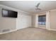 Bright bedroom features a neutral palette, large closet, ceiling fan and view to the exterior at 8155 E Juan Tabo Rd, Scottsdale, AZ 85255