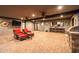 Covered outdoor patio with TV, ceiling fans, bar, and comfortable seating area at 8155 E Juan Tabo Rd, Scottsdale, AZ 85255
