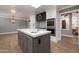 Kitchen area featuring stainless steel appliances, a center island, and hanging light fixture at 8155 E Juan Tabo Rd, Scottsdale, AZ 85255