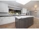 Bright kitchen with a center island, skylight, and view from the window over the sink at 8155 E Juan Tabo Rd, Scottsdale, AZ 85255