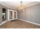 Sitting room with an ornate chandelier, and tiled flooring at 8155 E Juan Tabo Rd, Scottsdale, AZ 85255