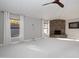 Open living room featuring a stone fireplace and carpeted floors at 8155 E Juan Tabo Rd, Scottsdale, AZ 85255