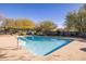 Backyard pool featuring clean water, landscaping and pool ladder for accessibility at 8155 E Juan Tabo Rd, Scottsdale, AZ 85255