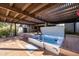 Outdoor spa on a wooden deck under a pergola for shade and relaxation at 8155 E Juan Tabo Rd, Scottsdale, AZ 85255