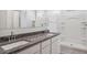 Modern bathroom features a double sink vanity, granite countertops, and a walk-in shower at 8534 W Mantle Way, Florence, AZ 85132