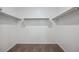 Empty walk-in closet with shelving, offering ample storage space at 8534 W Mantle Way, Florence, AZ 85132