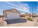 Exterior shot highlighting a single-Gathering house with a well-maintained front yard and a large garage door at 8551 E Kiowa Ave, Mesa, AZ 85209