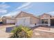 View of a single-story home, showcasing a spacious driveway, desert landscaping, and a welcoming facade at 8551 E Kiowa Ave, Mesa, AZ 85209