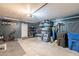 Functional garage featuring a workbench, storage shelves, and space for tools and equipment at 8551 E Kiowa Ave, Mesa, AZ 85209
