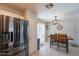 Bright kitchen with stainless steel refrigerator, adjacent dining area and tiled floors at 8551 E Kiowa Ave, Mesa, AZ 85209