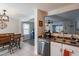 Kitchen featuring stainless steel dishwasher, coffee machine, and view into another living space at 8551 E Kiowa Ave, Mesa, AZ 85209