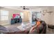 Cozy living room with a large gray sofa, modern television, and views into adjacent rooms at 8551 E Kiowa Ave, Mesa, AZ 85209