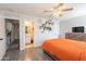 Spacious main bedroom with en-suite bathroom access and hardwood floors at 8551 E Kiowa Ave, Mesa, AZ 85209
