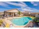 Backyard view of refreshing pool with blue water and nice landscaping at 8551 E Kiowa Ave, Mesa, AZ 85209