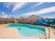 Lush backyard featuring a pool with blue water, plants, and landscaping at 8551 E Kiowa Ave, Mesa, AZ 85209