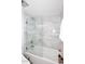 Bathroom showing marble tile surround, glass shower door, and modern fixtures at 8819 N 12Th Pl, Phoenix, AZ 85020