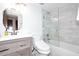 Bathroom showcasing sleek vanity, modern toilet, and tiled shower with glass door at 8819 N 12Th Pl, Phoenix, AZ 85020