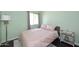 Bright bedroom with green walls, neutral accents, and sun-filled window at 8819 N 12Th Pl, Phoenix, AZ 85020