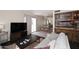 Bright living room with light walls, dark floors, and an adjacent dining area with chandelier at 8819 N 12Th Pl, Phoenix, AZ 85020
