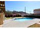 Community swimming pool with lounge chairs and clear blue water, set against a mountain backdrop at 8819 N 12Th Pl, Phoenix, AZ 85020