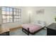 Simple bedroom setup with modern carpet, light walls, and a bed with a navy blue frame at 921 W University Dr # 1143, Mesa, AZ 85201