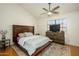 Cozy bedroom with hardwood floors, a modern bed frame, a dresser, and a ceiling fan at 921 W University Dr # 1143, Mesa, AZ 85201