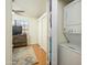 Bright bedroom features a stacked washer/dryer, ceiling fan, closet, and matching dresser at 921 W University Dr # 1143, Mesa, AZ 85201