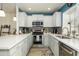 Well-equipped kitchen featuring white cabinets, stainless steel appliances, and stylish backsplash at 921 W University Dr # 1143, Mesa, AZ 85201