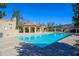 Community pool featuring crystal-clear water and a shaded cabana area at 921 W University Dr # 1143, Mesa, AZ 85201