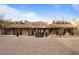 Inviting front entrance with a beautiful fountain, desert plants, and steps leading to an elegant Southwestern home at 9718 N Four Peaks Way, Fountain Hills, AZ 85268