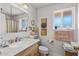 Well-lit bathroom featuring a vanity, storage cabinet, and neutral decor at 10801 W Mountain View Rd, Sun City, AZ 85351