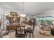 Open-concept dining area flows into the adjacent living spaces and sun room, ideal for both casual meals and formal gatherings at 10801 W Mountain View Rd, Sun City, AZ 85351
